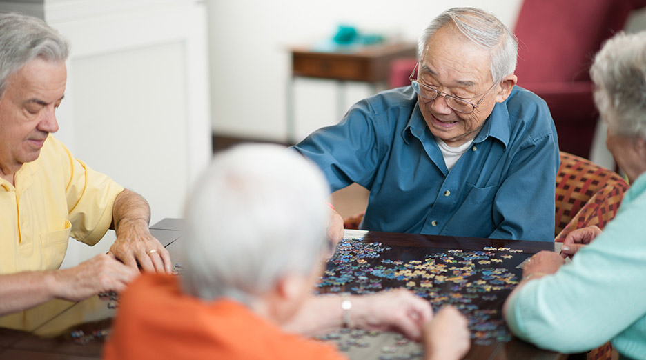 elderly playing with puzzle