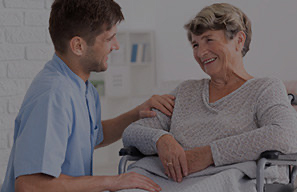 Person providing support to an older adult, representing assistance available through the Bridge fund at Moose Lake Village.