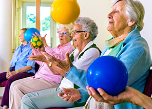 Residents participating in a group exercise class, representing wellness and fitness opportunities at Moose Lake Village.