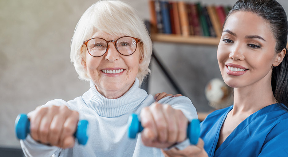 Older adult participating in strength training with a therapist, representing short-term rehabilitation at Moose Lake Village.