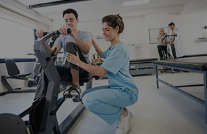 Therapy session using rehabilitation equipment, representing investments in care technology and equipment at Moose Lake Village.