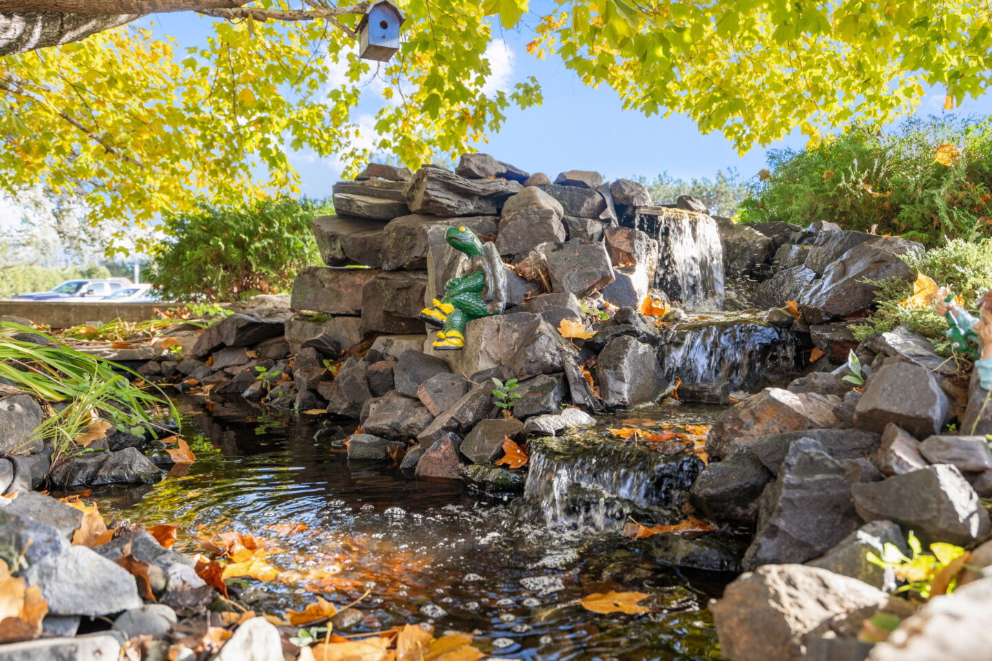 Waterfall and pond feature in the outdoor gardens at Moose Lake Village in Moose Lake, Minnesota.